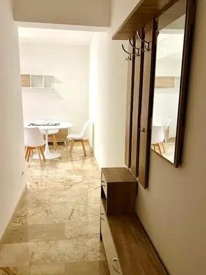 a living room with a mirror and a table at Trastevere Ripa Apartments in Rome