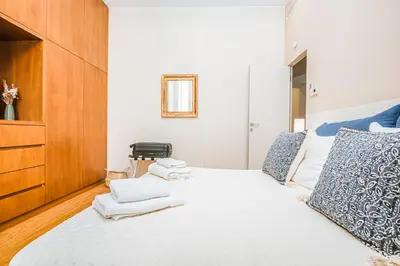 a bedroom with a bed with towels on it at DAMA APARTMENT 2 camere da letto 2 bagni con doccia in Rome