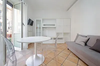 a living room with a table and a couch at Testaccio Sweet Holiday Apt in Rome