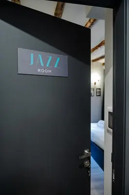 a bathroom with a white sink and a toilet at SONUS Colosseum in Rome