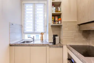 a small kitchen with a sink and a window at GuestHost - San Giovanni Comfy Apartment in Rome