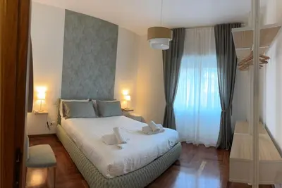a bedroom with a bed with two towels on it at Gina's House Trastevere Station in Rome