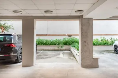 a parking lot with two cars parked in it at Private Condo Terrace & Parking in Rome