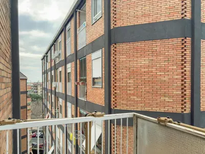 an empty balcony of a brick building with a building at Portuense Paradise in Rome