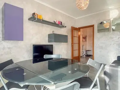 a dining room with a glass table and chairs at Portuense Paradise in Rome