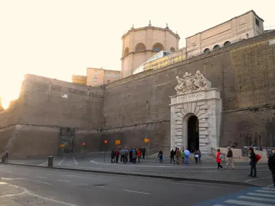 a group of people standing in front of a building at San Pietro Experience in Rome