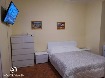 a bedroom with a white bed and a window at DuPigne' House in Rome