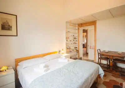 a bedroom with a bed and a table and a desk at Vicino alla Basilica di Santa Maria Maggiore in Rome