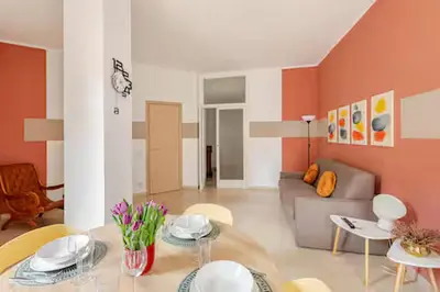 a living room with a couch and a table and chairs at Casa Bella in Rome