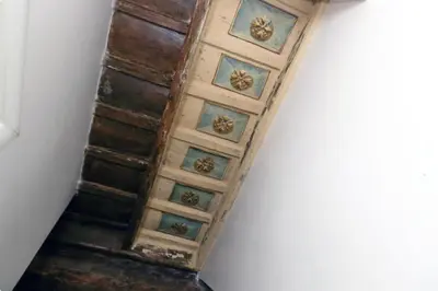 an old wooden stairway with tiles on a ceiling at Limani - Campo de' Fiori Private Retreat in Rome