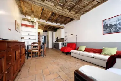 a living room with a couch and a table at Limani - Campo de' Fiori Private Retreat in Rome