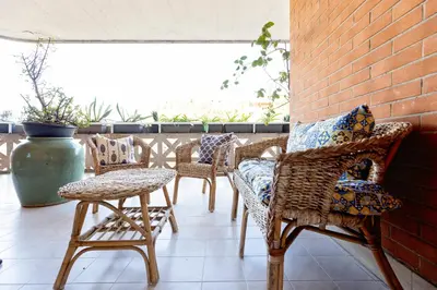 a group of chairs and tables on a patio at Holiday Home Roma in Rome