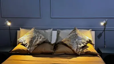 a bed with pillows on it in a bedroom at Raffy in Rome in Rome