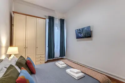 a living room with a couch and a window at Fresh House Ludovisi in Rome