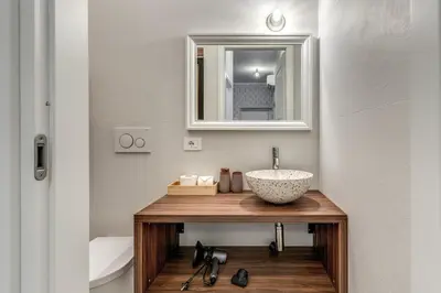 a bathroom with a sink and a mirror at Casa Bixio Fantastico appartamento nel cuore di Roma in Rome
