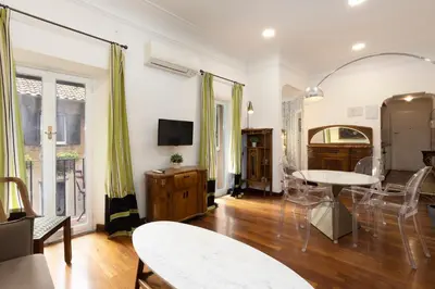 a living room with a table and chairs at Cozy Gambero Apartments in Rome