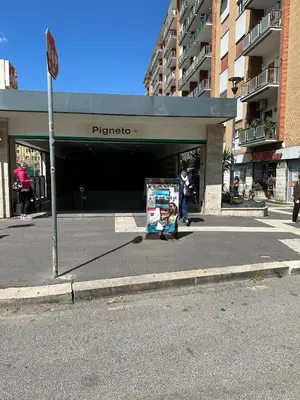 a woman and a child walking in front of a store at Imperial Apartment in Rome
