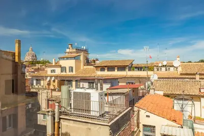 a view of a city with roofs and buildings at Spanish Steps Exclusive 3BDR in Rome