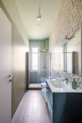 a bathroom with a sink and a toilet at San Giovanni Living House 2 in Rome