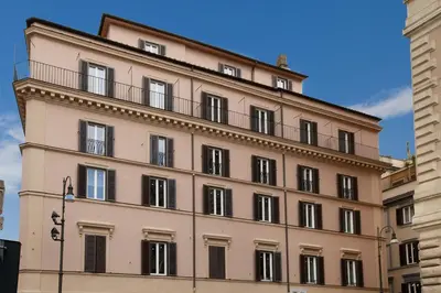 a large building with a balcony on top of it at Oriana Homèl Roma in Rome