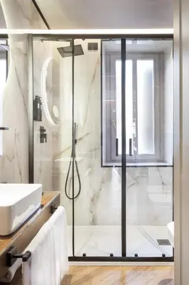 a bathroom with a shower and a sink at Oriana Homèl Roma in Rome