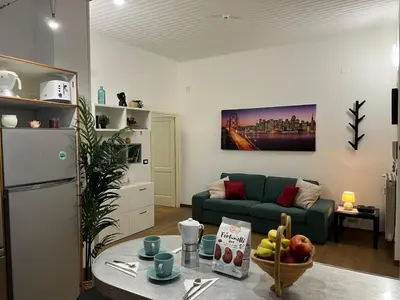 a living room with a couch and a table at Tiburtina68 central apartment in Rome