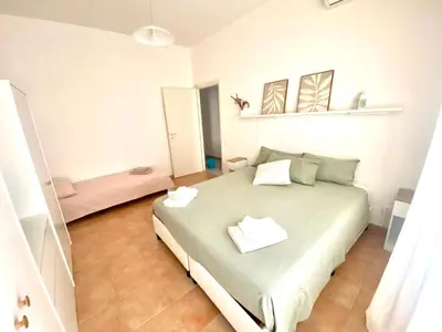 a bedroom with a large bed in a room at La Casa di Giada in Rome