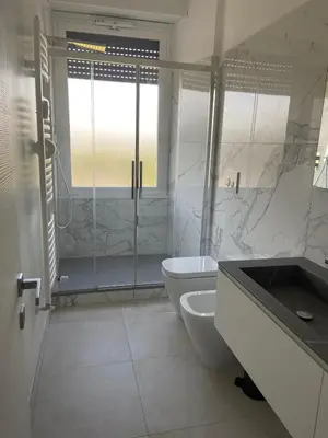 a bathroom with a shower and a toilet and a sink at Apartment in the heart of Rome in Rome
