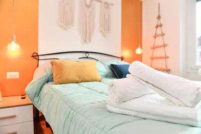 a bedroom with a bed with towels on it at Nest house in Rome