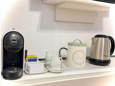 a coffee maker and a tea kettle on a kitchen counter at La Casa Blu in Rome