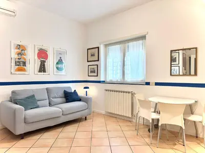 a living room with a couch and a table at La Casa Blu in Rome