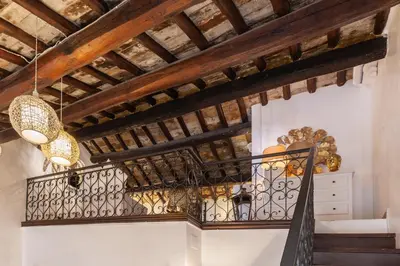 a staircase in a house with wooden ceilings at Piazza Navona Loft for 7 people in Rome