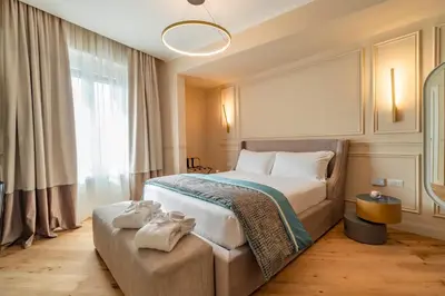 a bedroom with a large bed with towels on it at Trevi Imperial Suite 1 in Rome