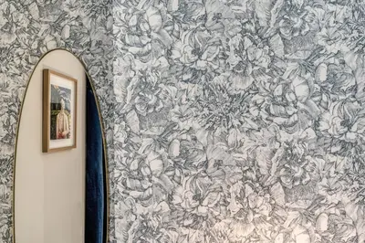 a wall with a blue and white floral wallpaper at DOWNTOWN SRL - The Great Court and The Great Chill in Rome