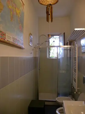 a bathroom with a shower and a sink at Esquilino Piano Alto in Rome
