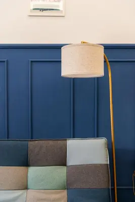 a lamp sitting next to a couch in a room at Casa Vacanze Ourplaces Sacchetti in Rome