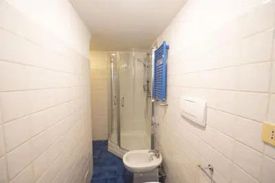 a bathroom with a shower and a toilet at Cozy 2BR Apartment near Piazza Navona in Rome