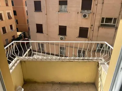 a balcony with a white staircase in a building at Clodio Apartment in Rome