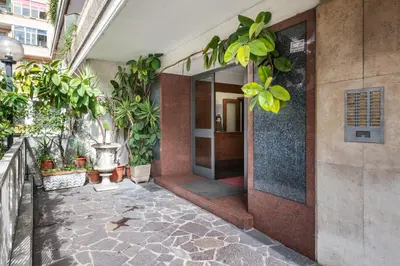 an entrance to a building with potted plants at NOH Vatican Studio in Rome