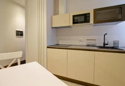 a kitchen with a sink and a microwave at SirtHouse in Rome