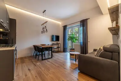 a living room with a couch and a table at CS Vatican Metro Apartment in Rome