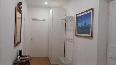 a white room with a mirror and a picture on the wall at Il regno dei colori in Rome