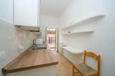 a kitchen with a sink and a counter top at Juan&Elisa Trevi by BuddyRent in Rome