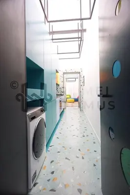 a laundry room with a washing machine and a hallway at GALAXY By ROMEI in Rome