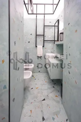 a bathroom with two sinks and two toilets at GALAXY By ROMEI in Rome