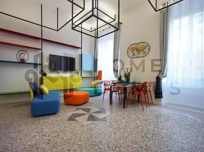 a living room with a table and chairs at GALAXY By ROMEI in Rome