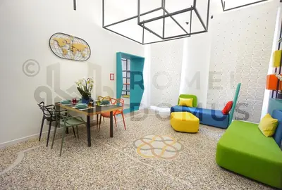 a dining room with a table and chairs at GALAXY By ROMEI in Rome