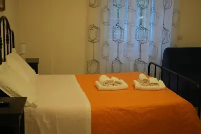a bedroom with a bed with towels on it at Casa Giovanna in Rome