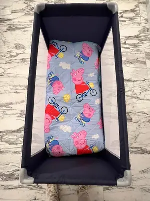 a bed with hello kitty pillows on it at Casa Vale in Rome