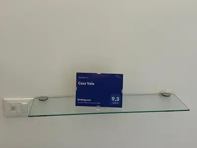 a glass shelf with a box on top of it at Casa Vale in Rome
